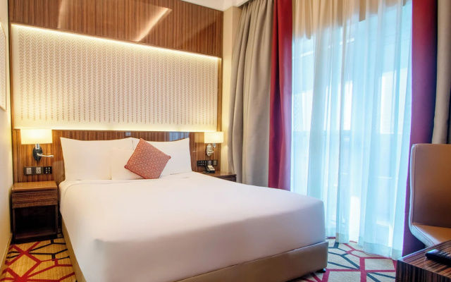 Отель Naumi Dubai