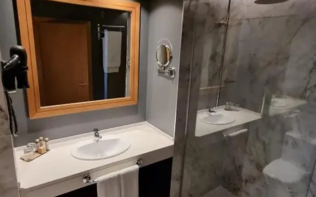 Отель Versatile