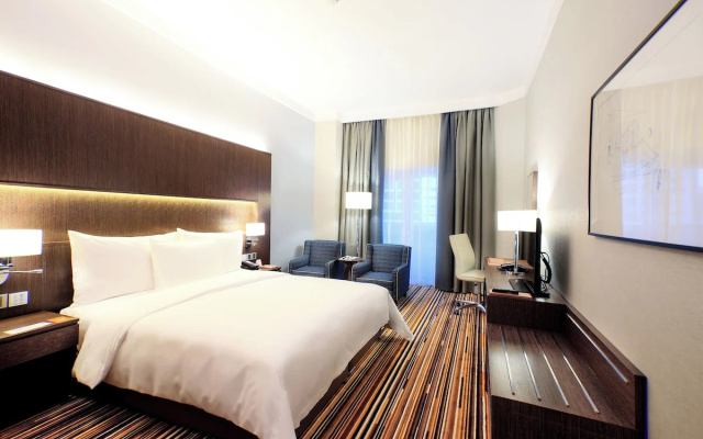 Отель Naumi Dubai