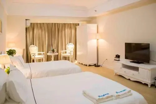 Qingdao Bedom Apartment Jinsha Bay — отель с удобствами в Циндао