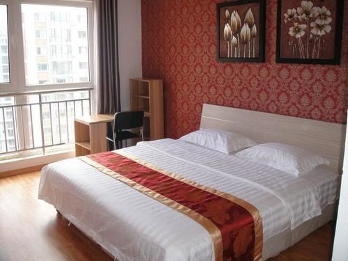 Qingdao Fuzhi Xiangming Family Apartment — забронировать отель в Циндао