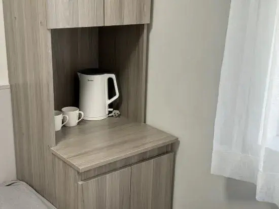 Houmujia Apartment (Shanghai Shaanxi South Road Subway Station Store) — отель с удобным расположением в Шанхае