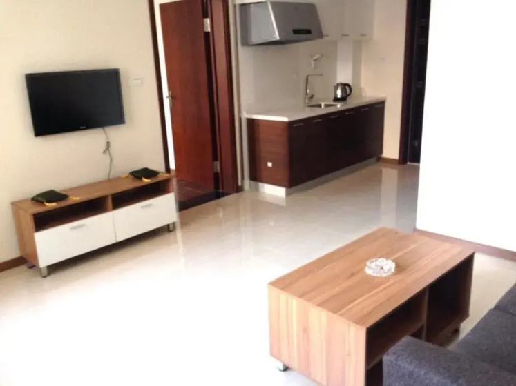 Sunshine Service Apartment — комфортный отель в Даляне
