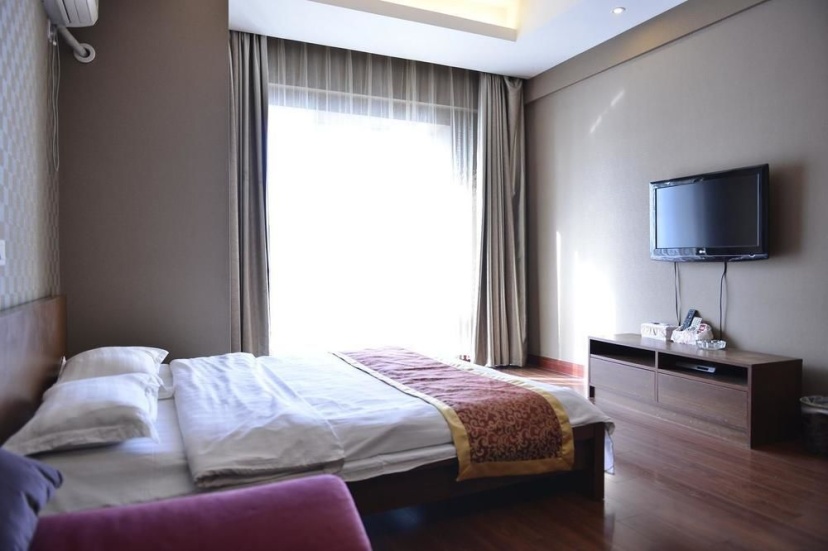 Enji Apartment Xinghai Daguan Branch — комфортный отель в Даляне