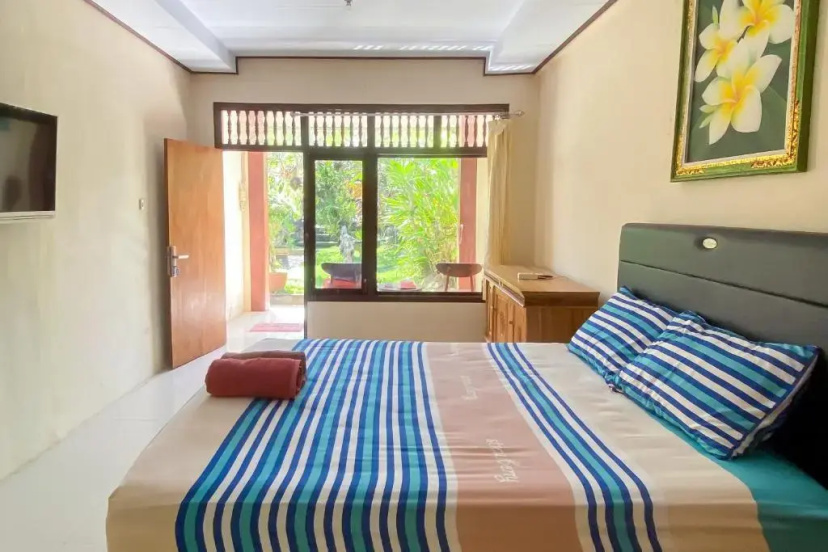 Raja Asri Guest House Sanur Mitra RedDoorz 2 — отель в Денпасар, Индонезия