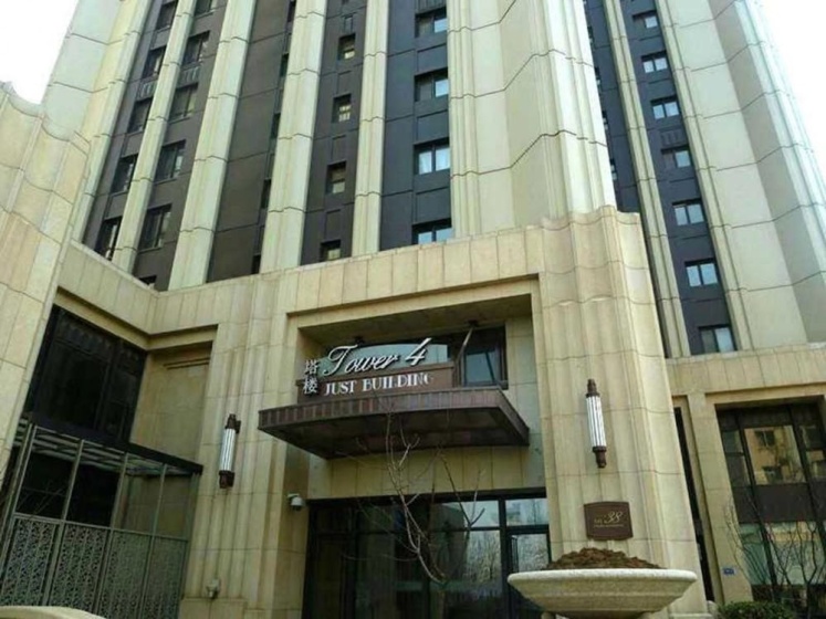 Dalian Xinghai Ingres Garden Apartment — отель с удобствами в Даляне