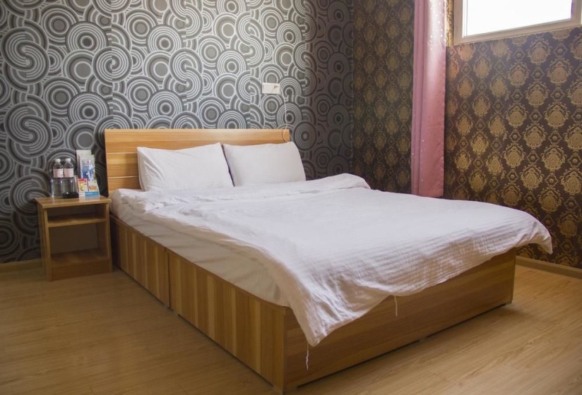 Qingdao Qianshanhouhai Apartment — отель с удобствами в Циндао