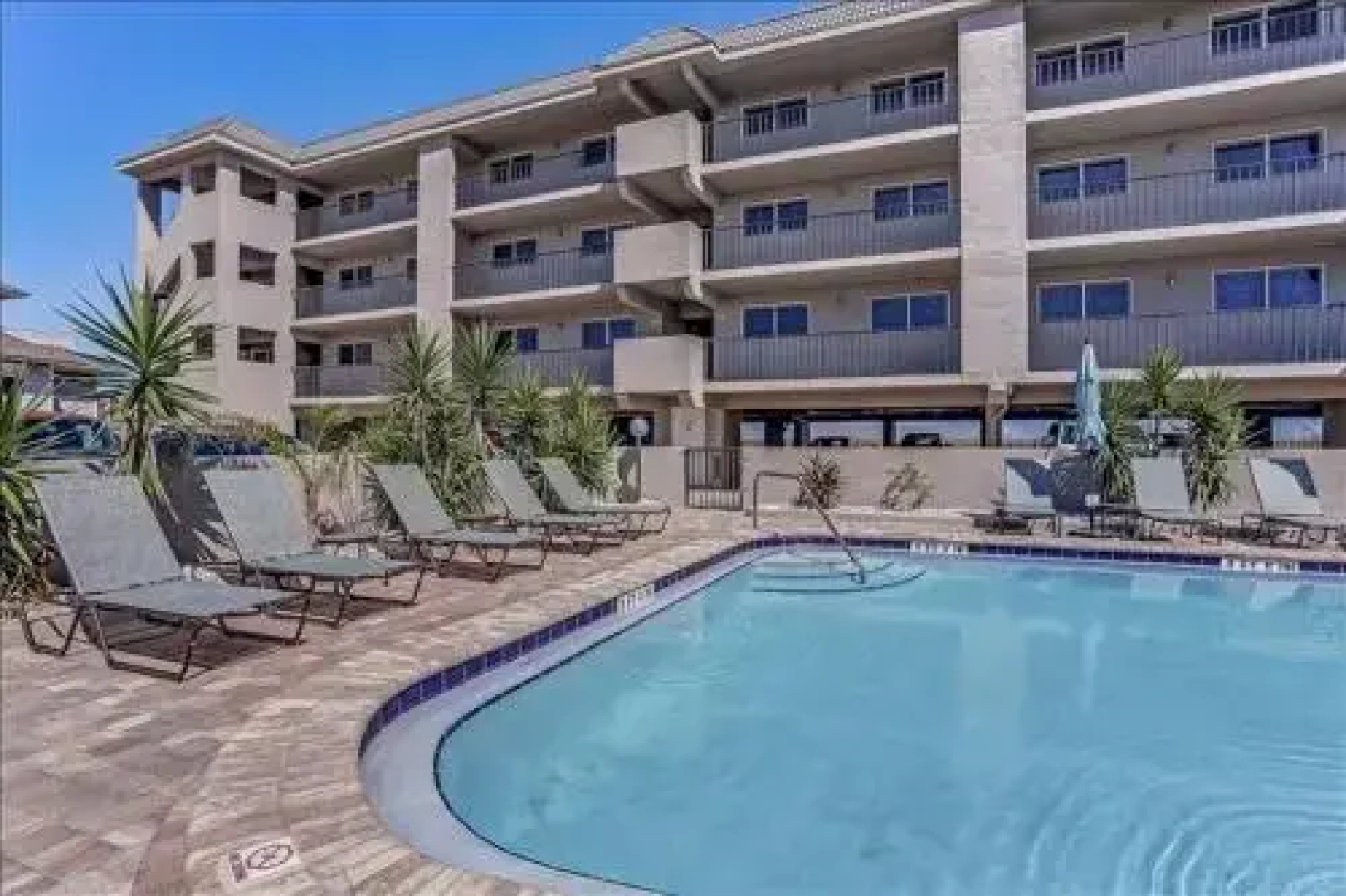 Seashore Condo with Balcony Overlooking the beach and the Atlantic by RedAwning
