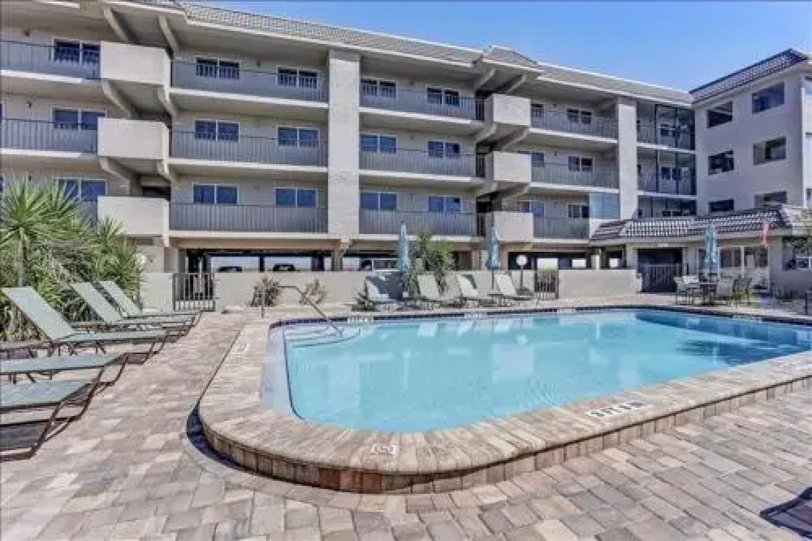 Seashore Condo with Balcony Overlooking the beach and the Atlantic by RedAwning