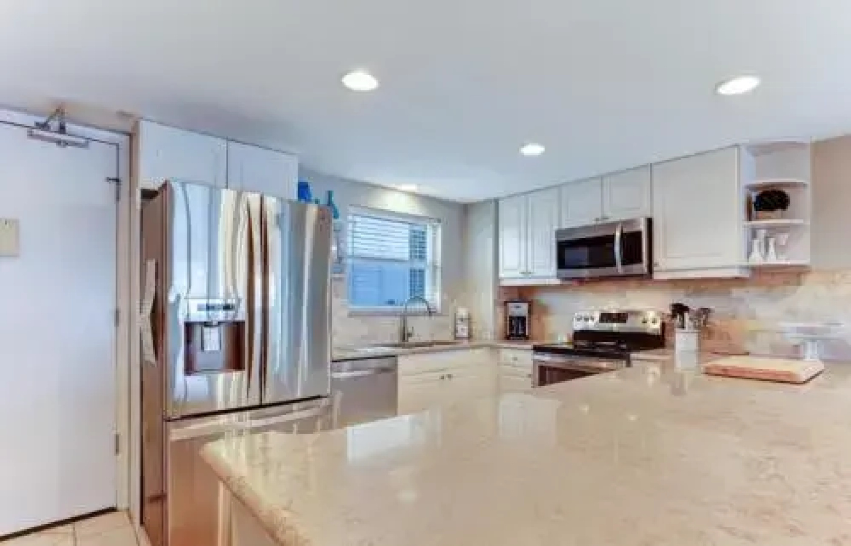 North End Corner Unit with View of the Ocean and Miles of Sandy Beach by RedAwning