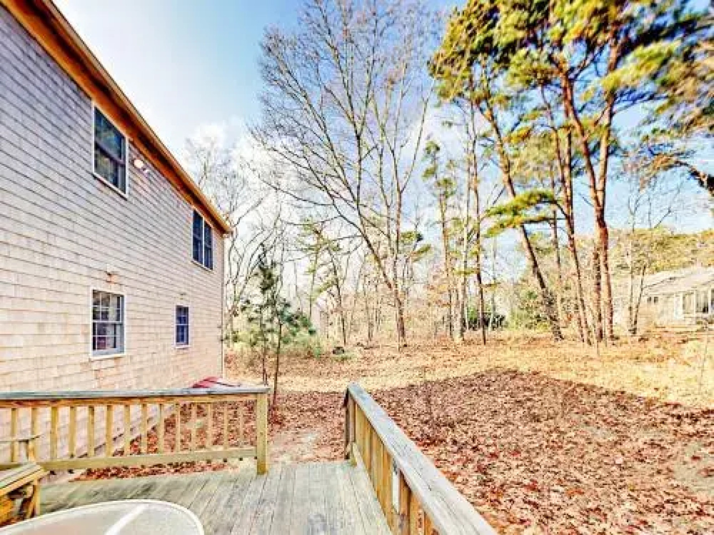 Woodsy Cape Cod Home by RedAwning