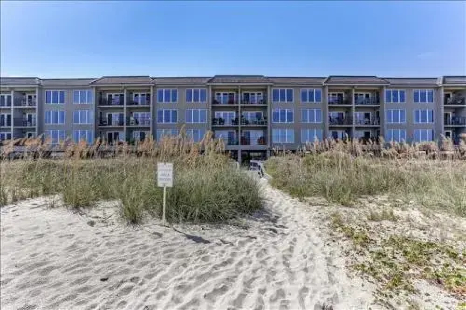 Seashore Condo with Balcony Overlooking the beach and the Atlantic by RedAwning