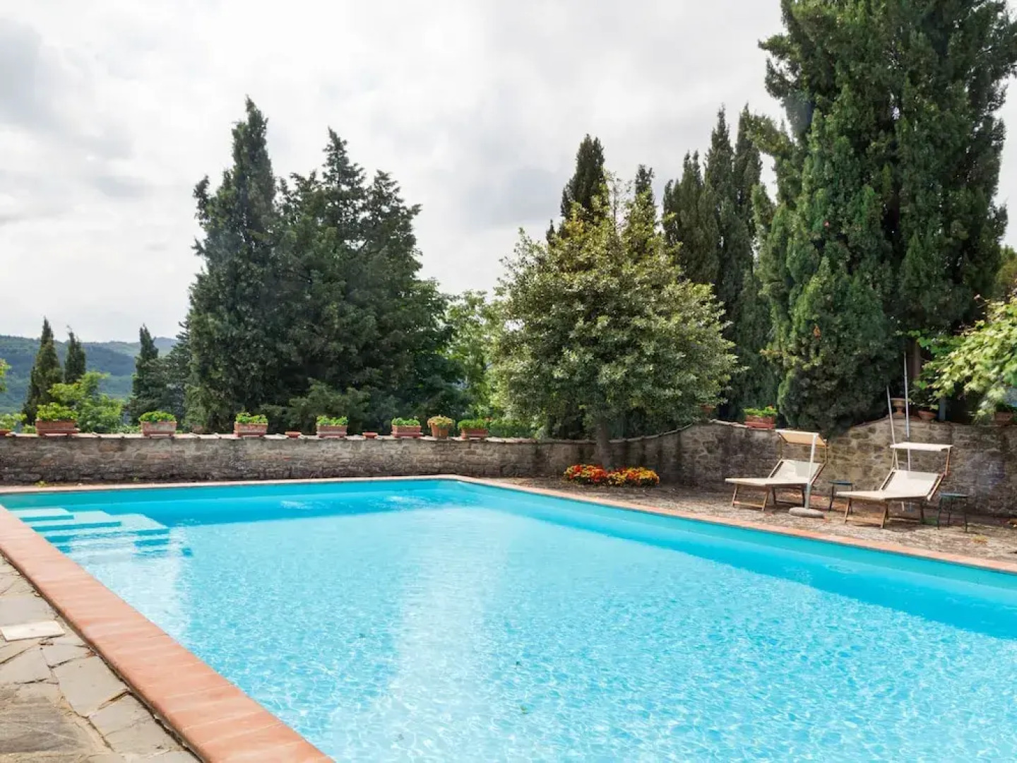 House on the Property Next to an Ancient Villa With a View of the Hills and Pool