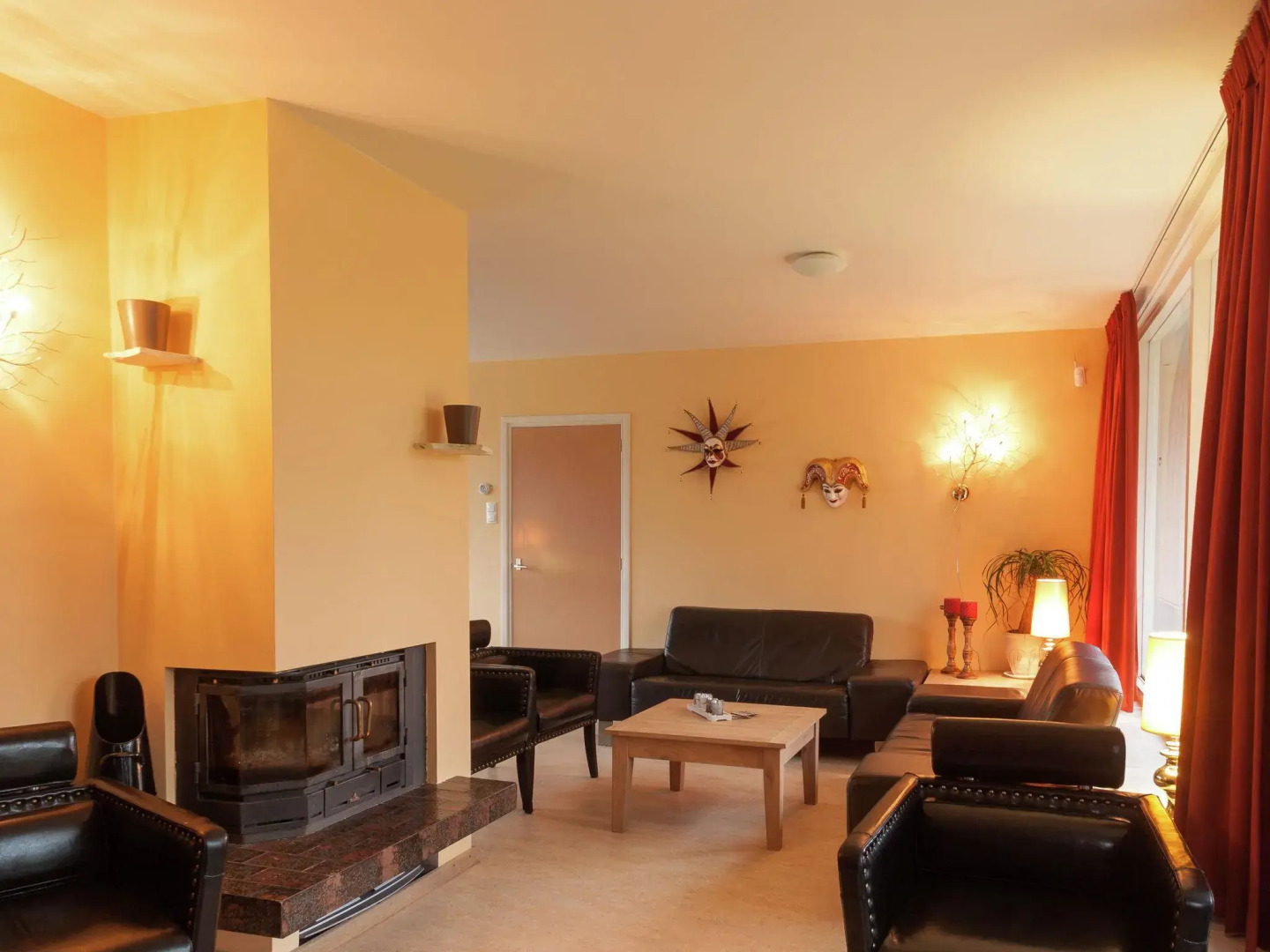 Cozy decorated house with fireplace, surrounded by forest