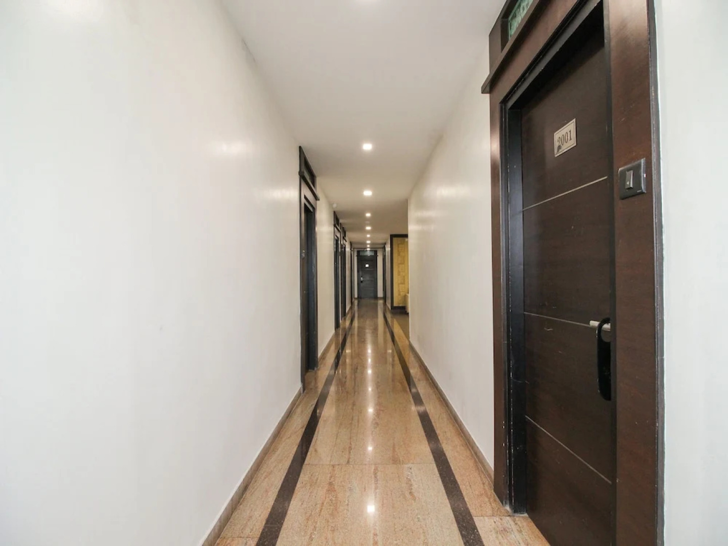 Capital O 15964 NI Ambaari Suites