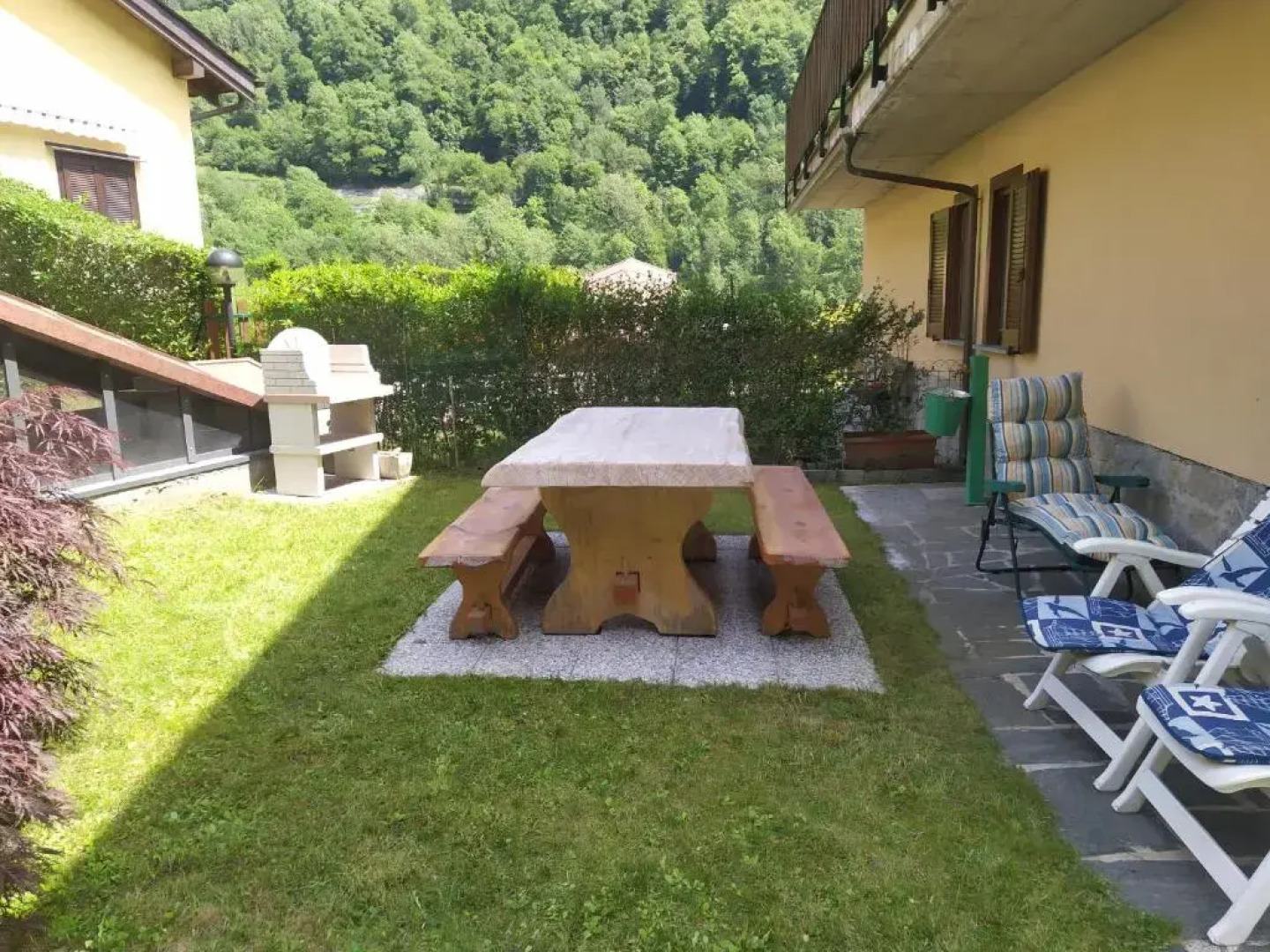 bilocale con giardino e box