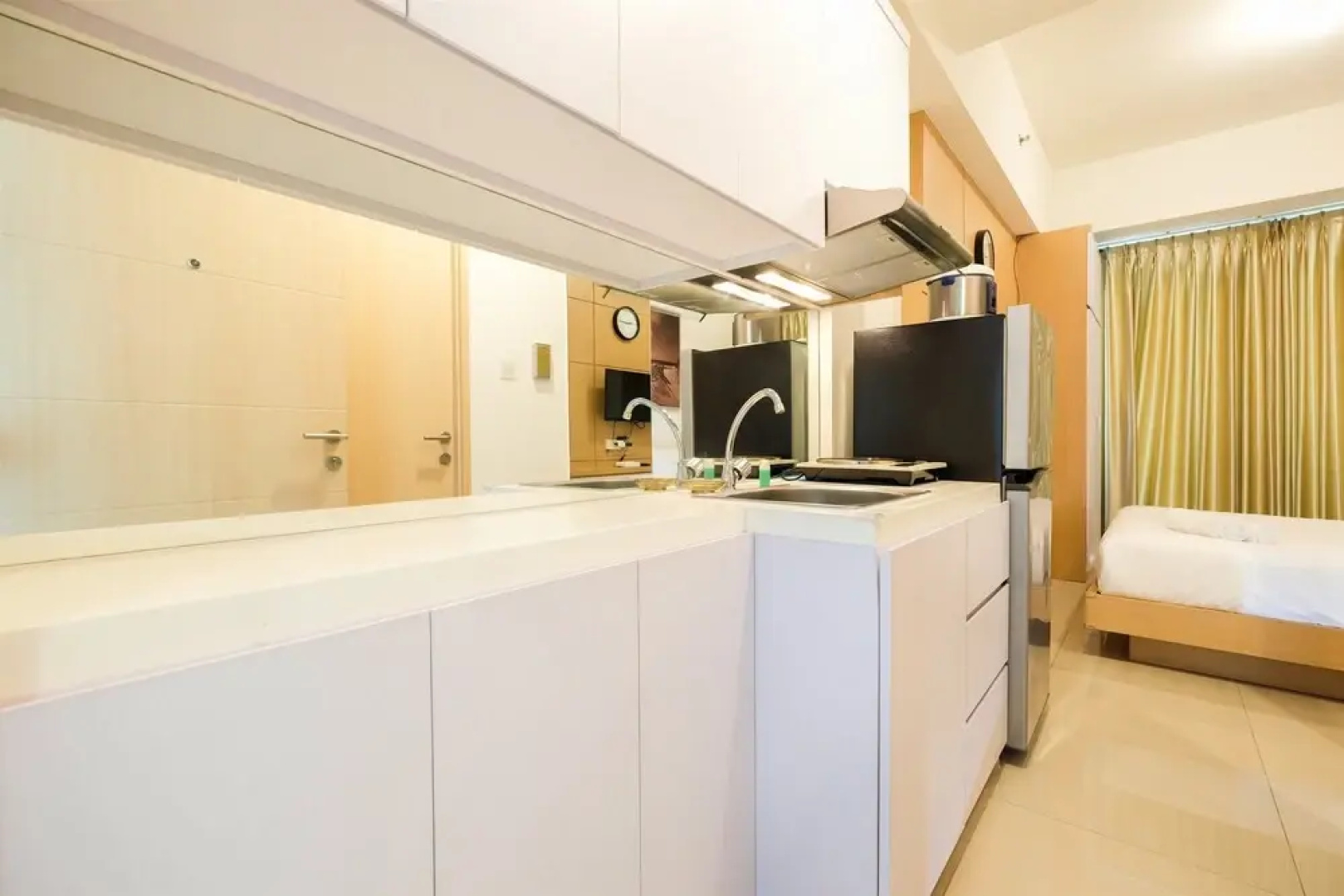 Homey Studio Room Tree Park Apartment near BSD City By Travelio