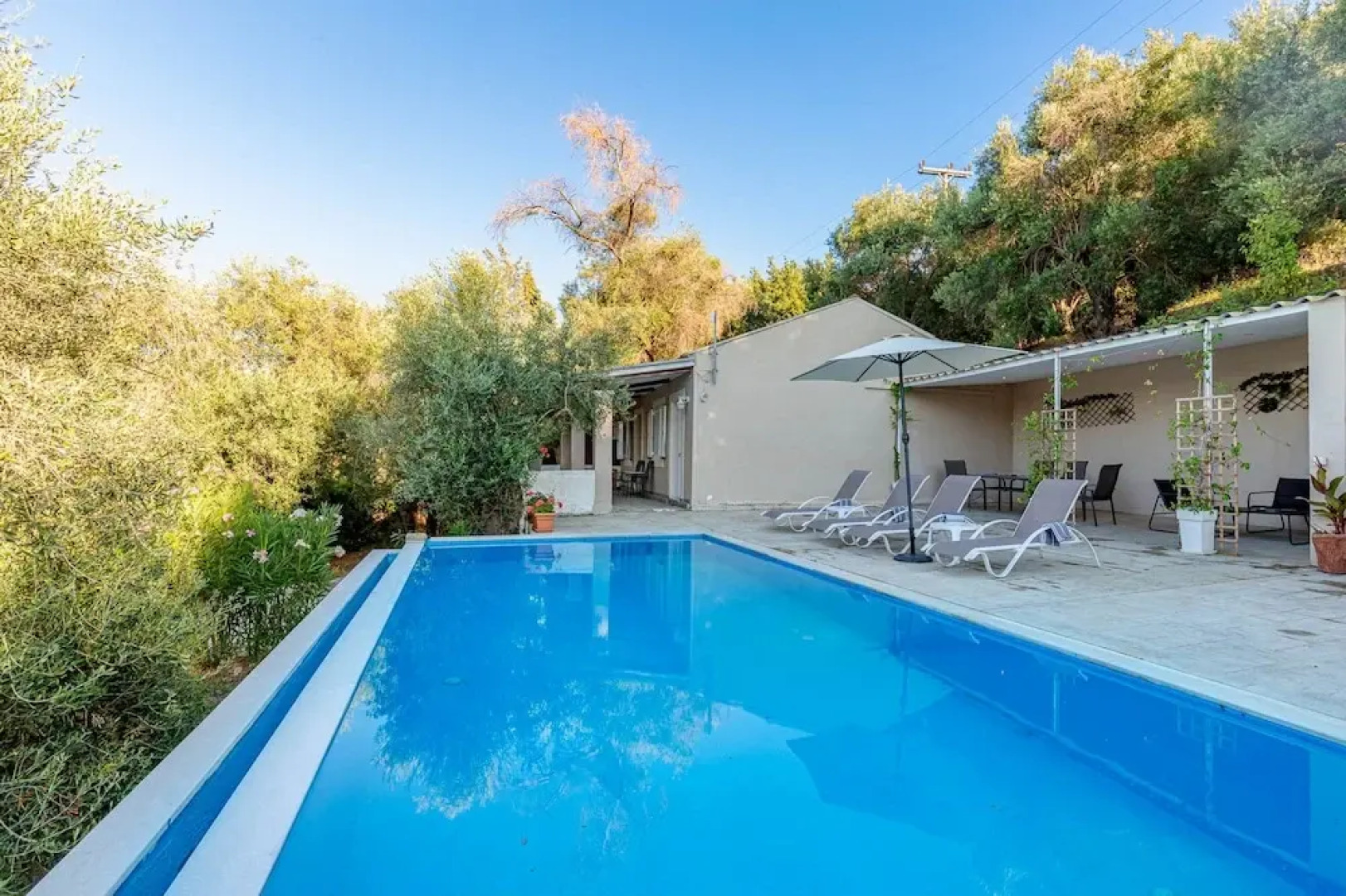 Deja Blue Beach Pool House by Estia