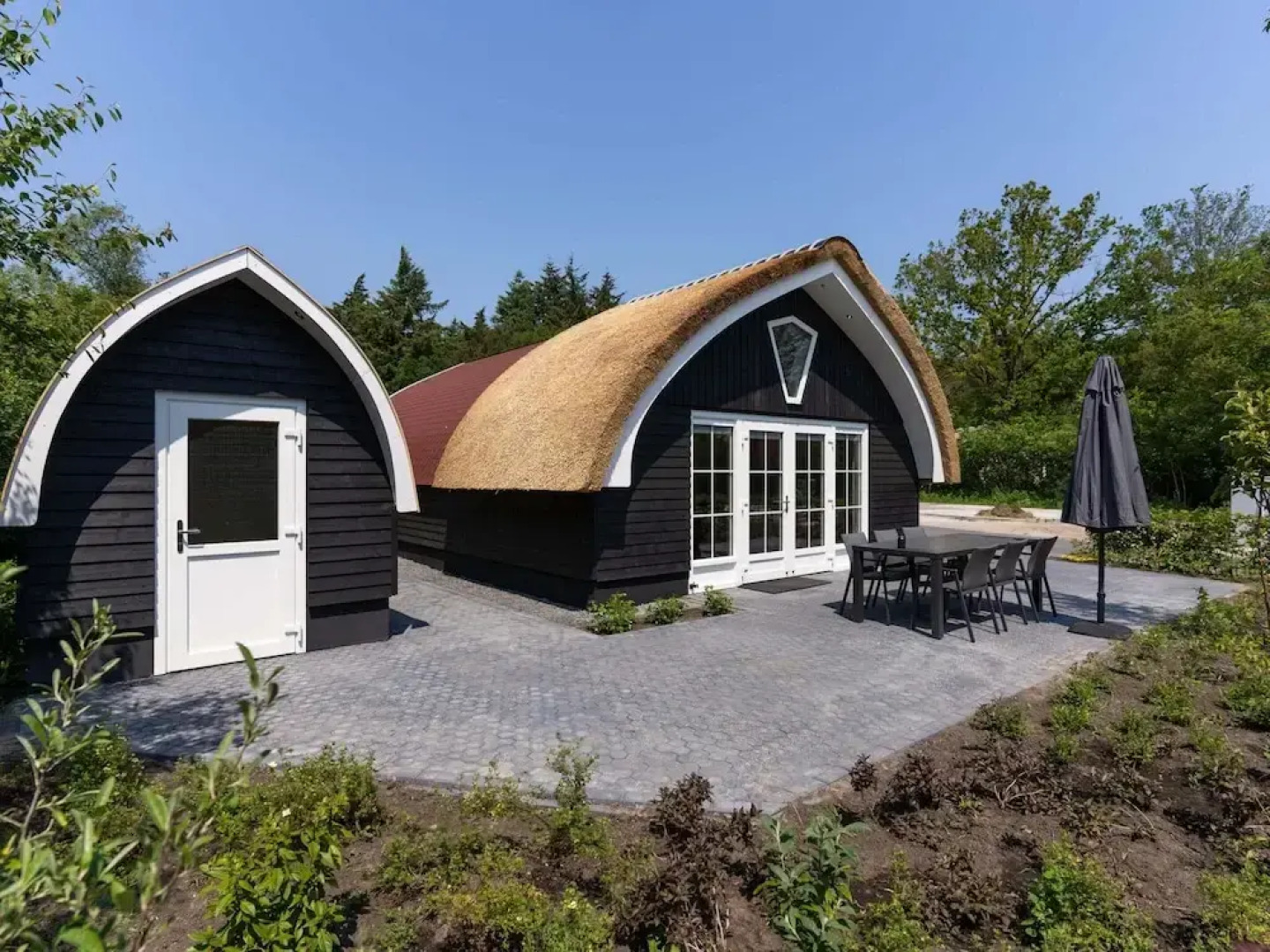 House With a Terrace on the Edge of the Forest