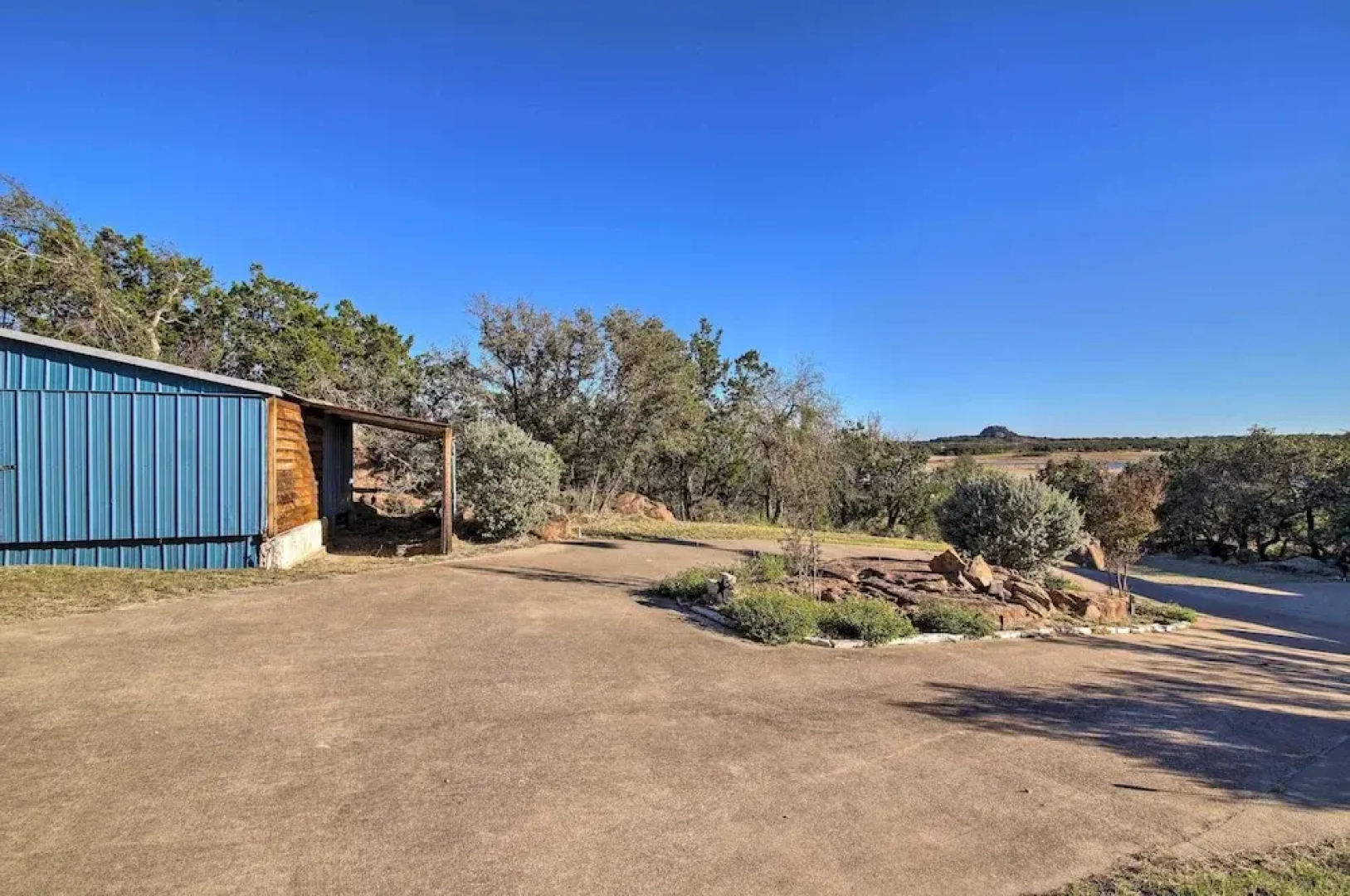 Sunny Lakefront Escape w/ Private Beach & Deck