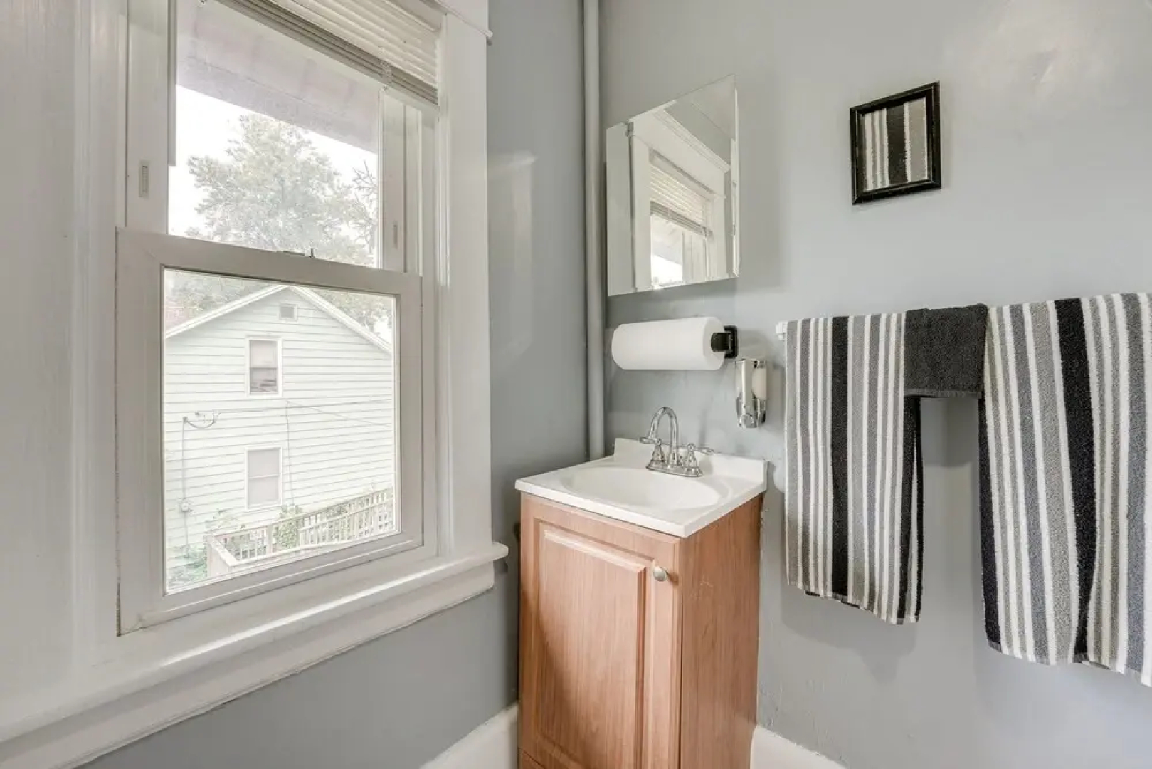 Centrally Located Albion Home With Screened Porch!