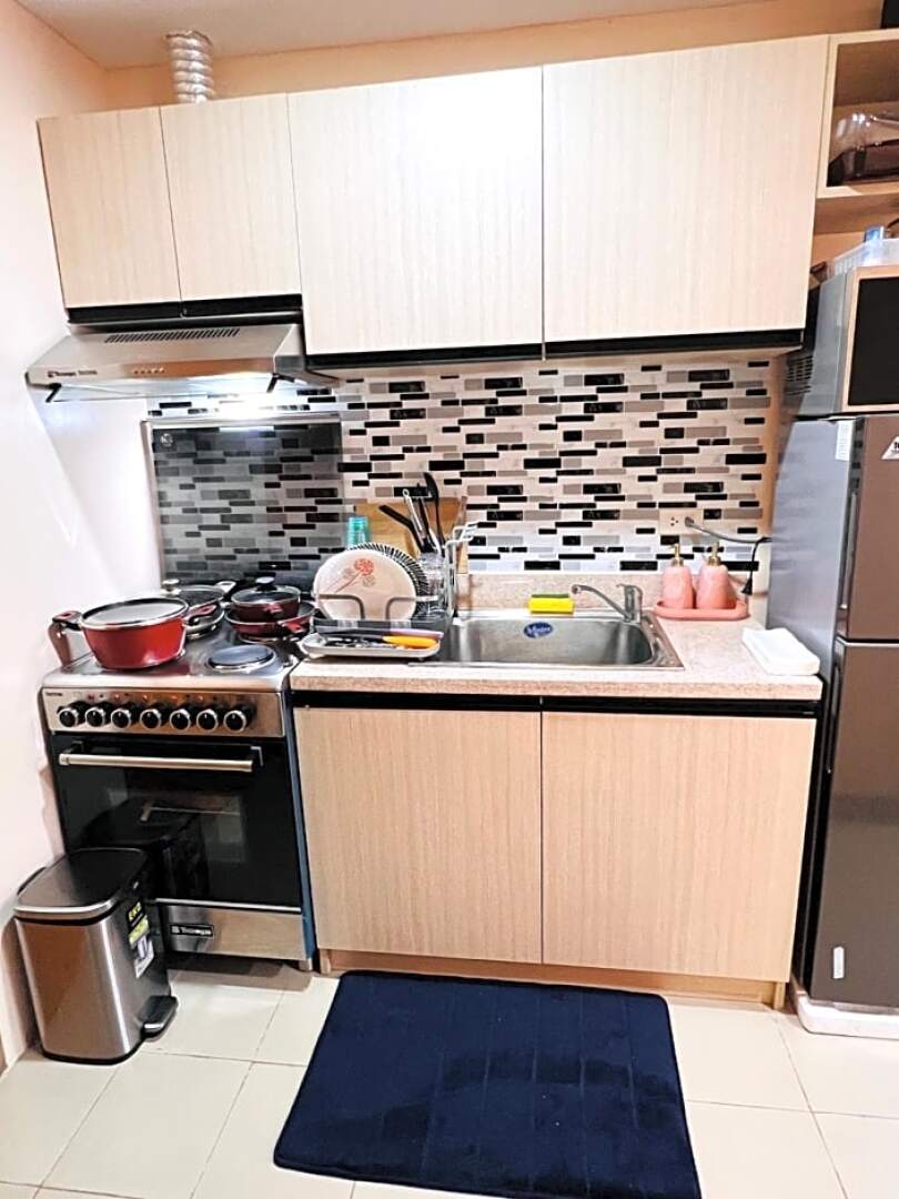 New Cozy 2 bedroom unit condotel for staycation with living room and kitchen set with pool