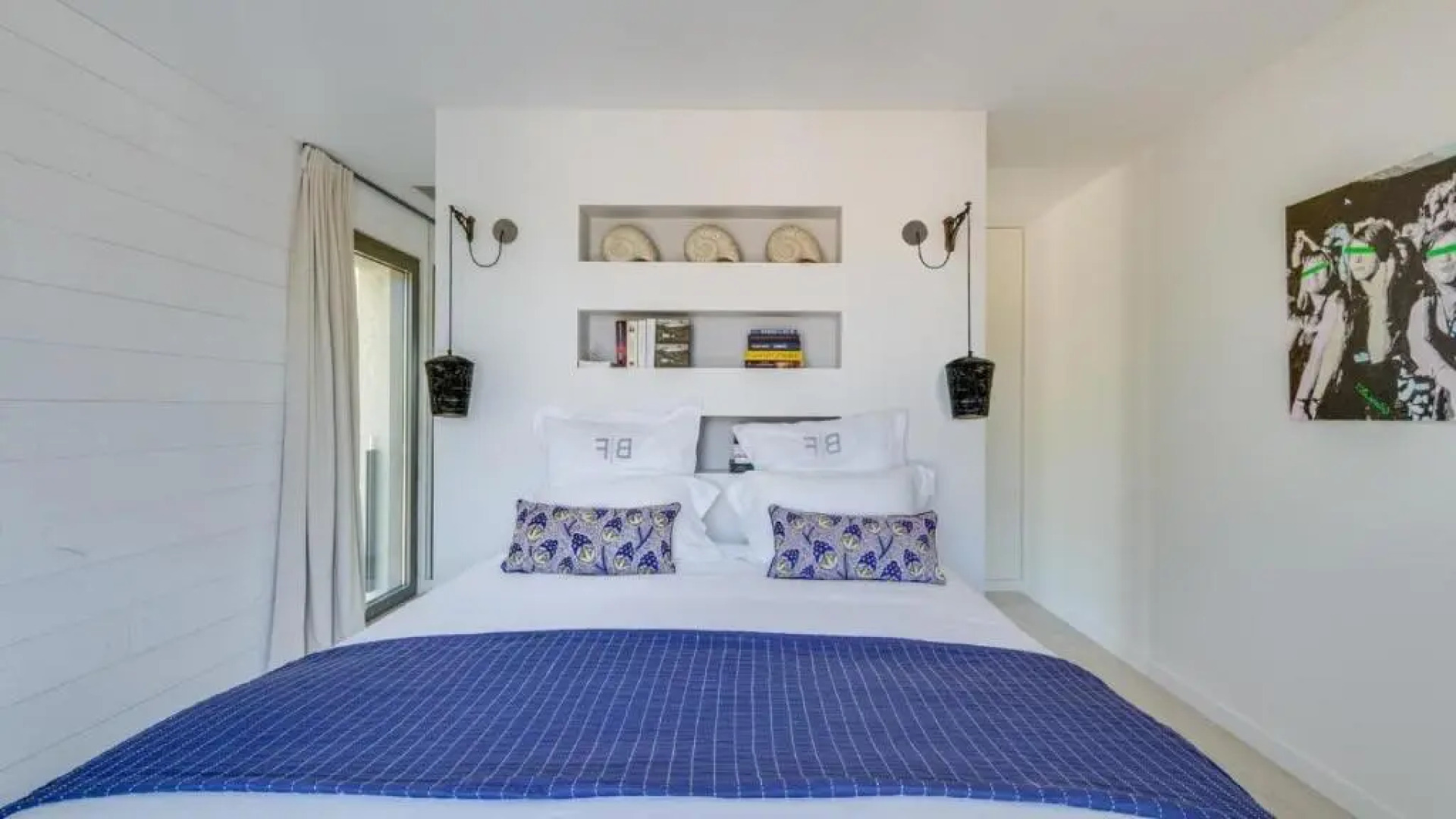 A large table with chairs and a garden furniture with sunbeds