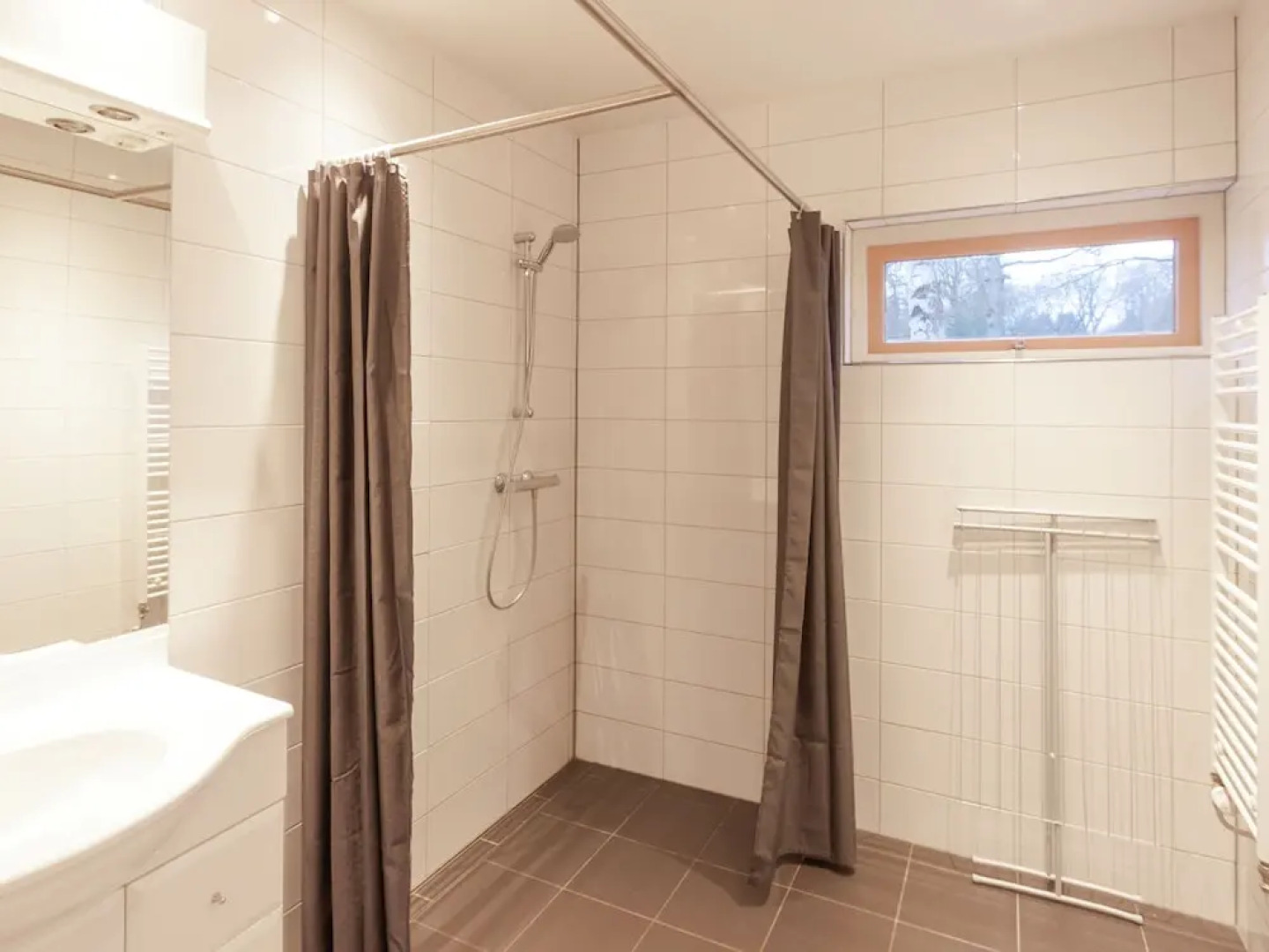 Cozy decorated house with fireplace, surrounded by forest