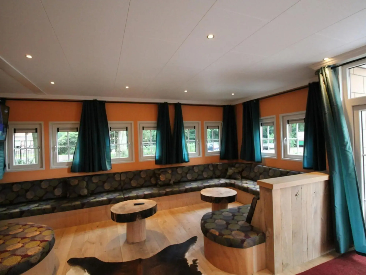 Designed home with bedstead, surrounded by forest