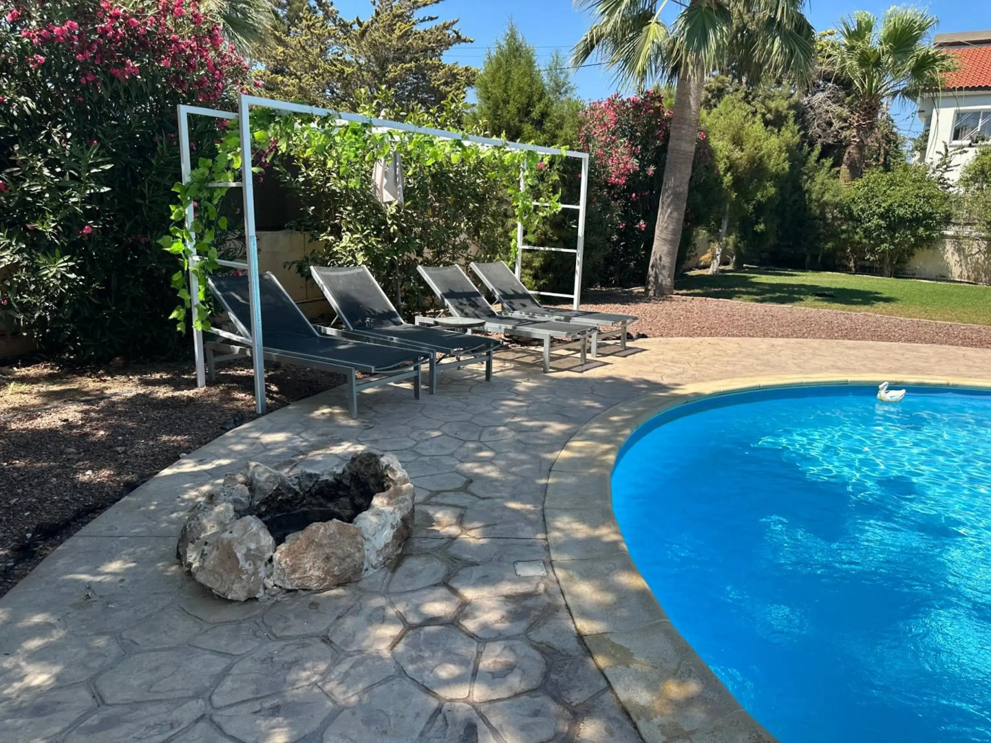 Mediterranean poolside garden cottage