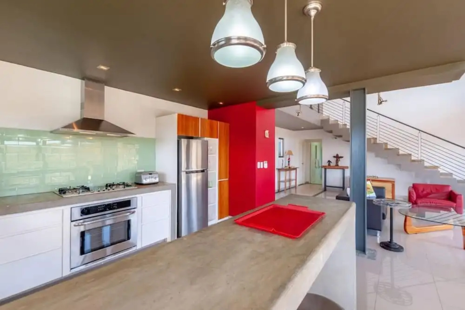 Modern Hillside Home with Sleek Interiors and Panoramic Poolside Views