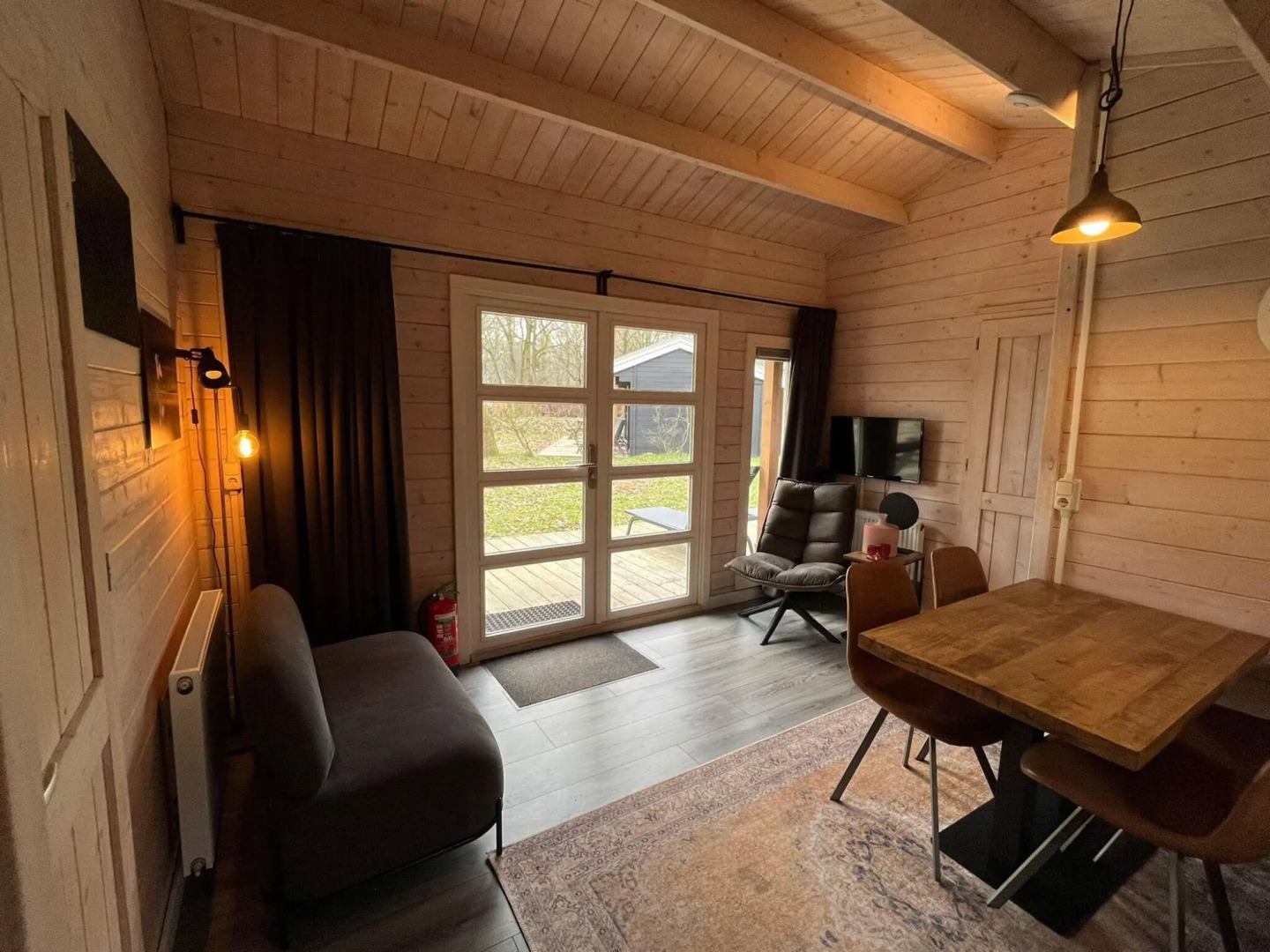 Wooden chalet with microwave, on a holiday park near three national parks