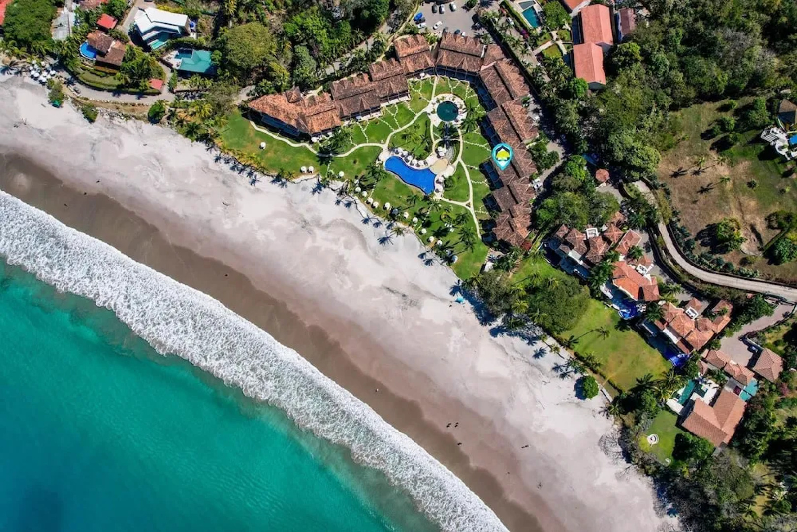 Luxury Beachfront Condo w/ High-End Wood Furnishings and Ocean Views in Exclusive Community