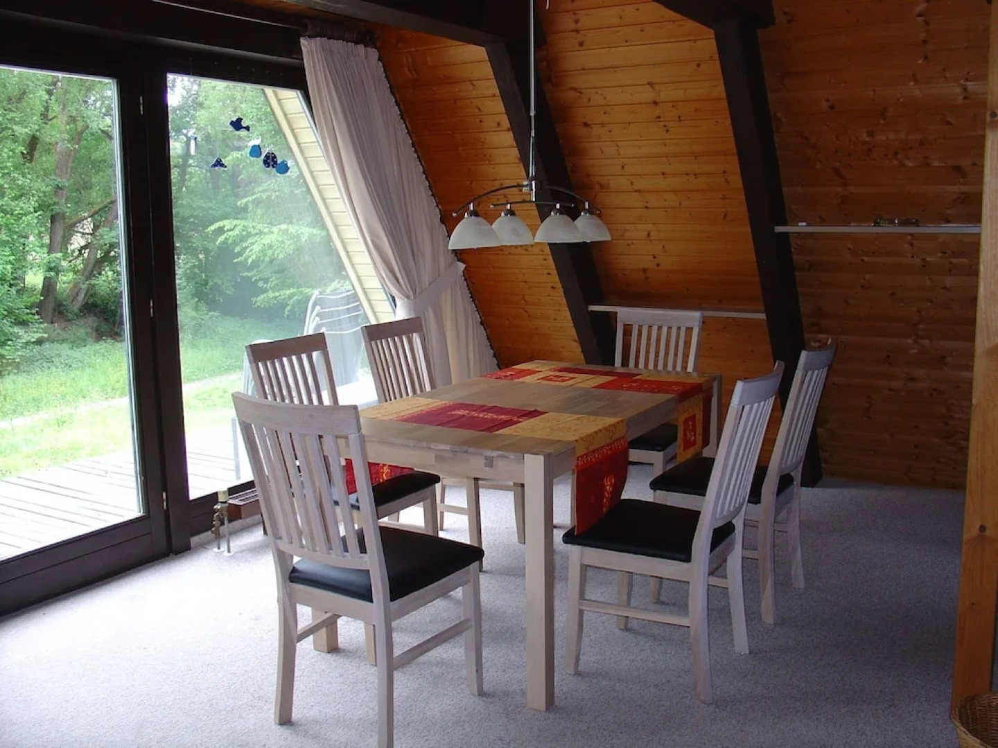 Detached, wooden bungalow with a terrace, in a wooded area