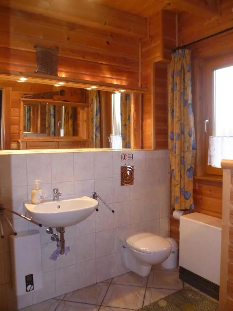 Holzblockhaus mit Kamin am Kite-, Surf- und Badestrand