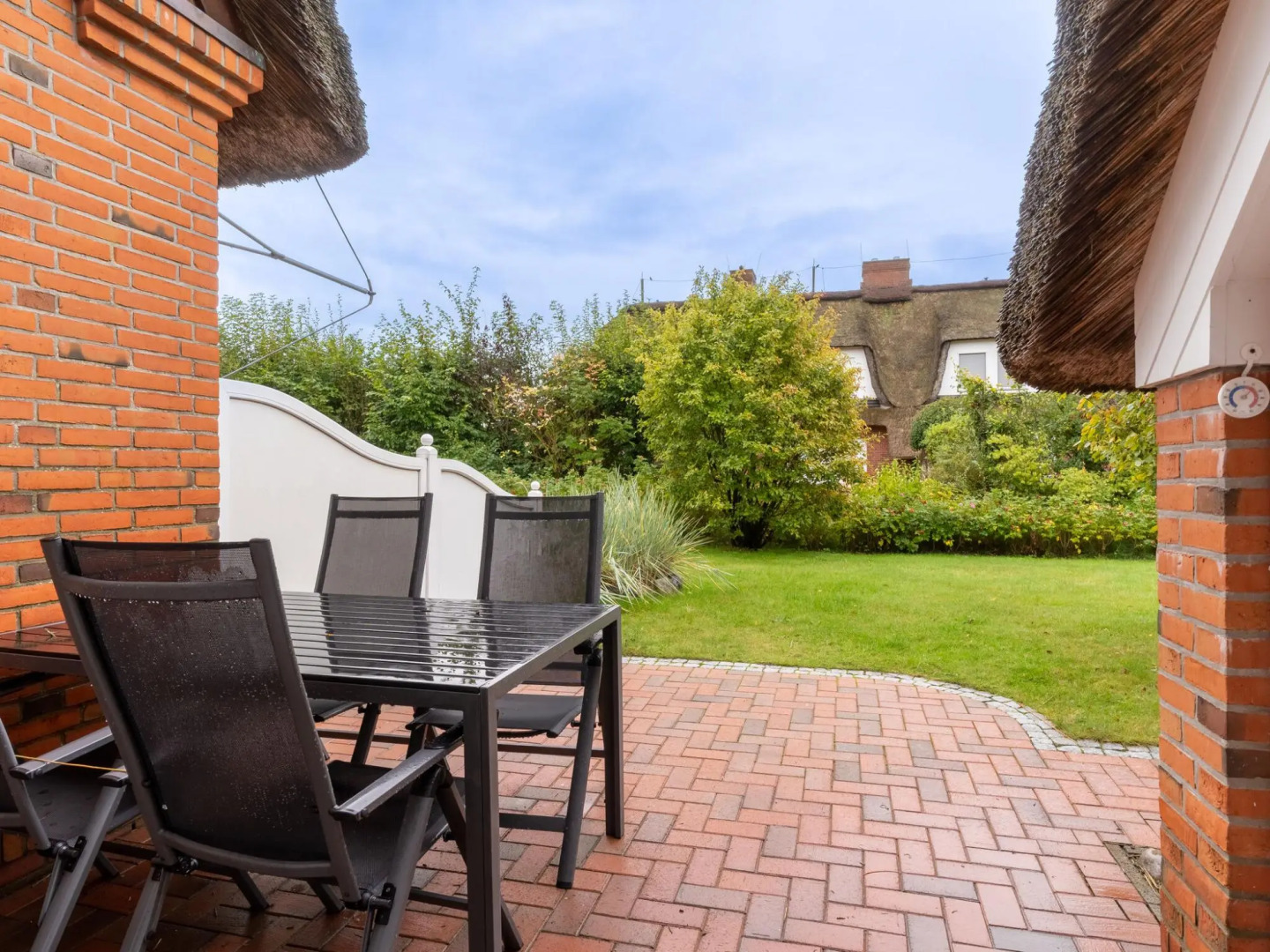 Holiday apartment with a fireplace in a thatched apartment house