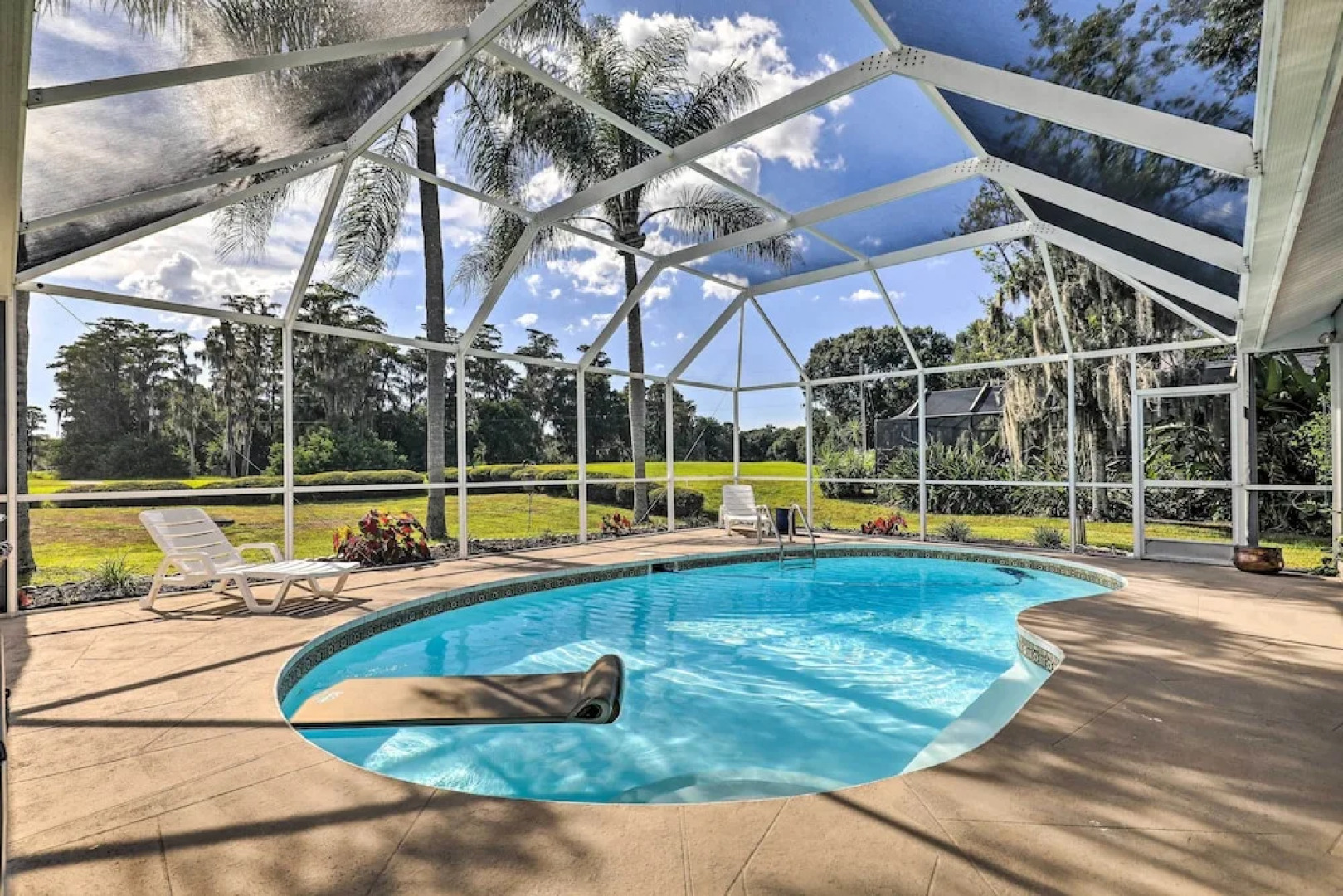 Palm Harbor Home w/ Pool & Golf Course Views!
