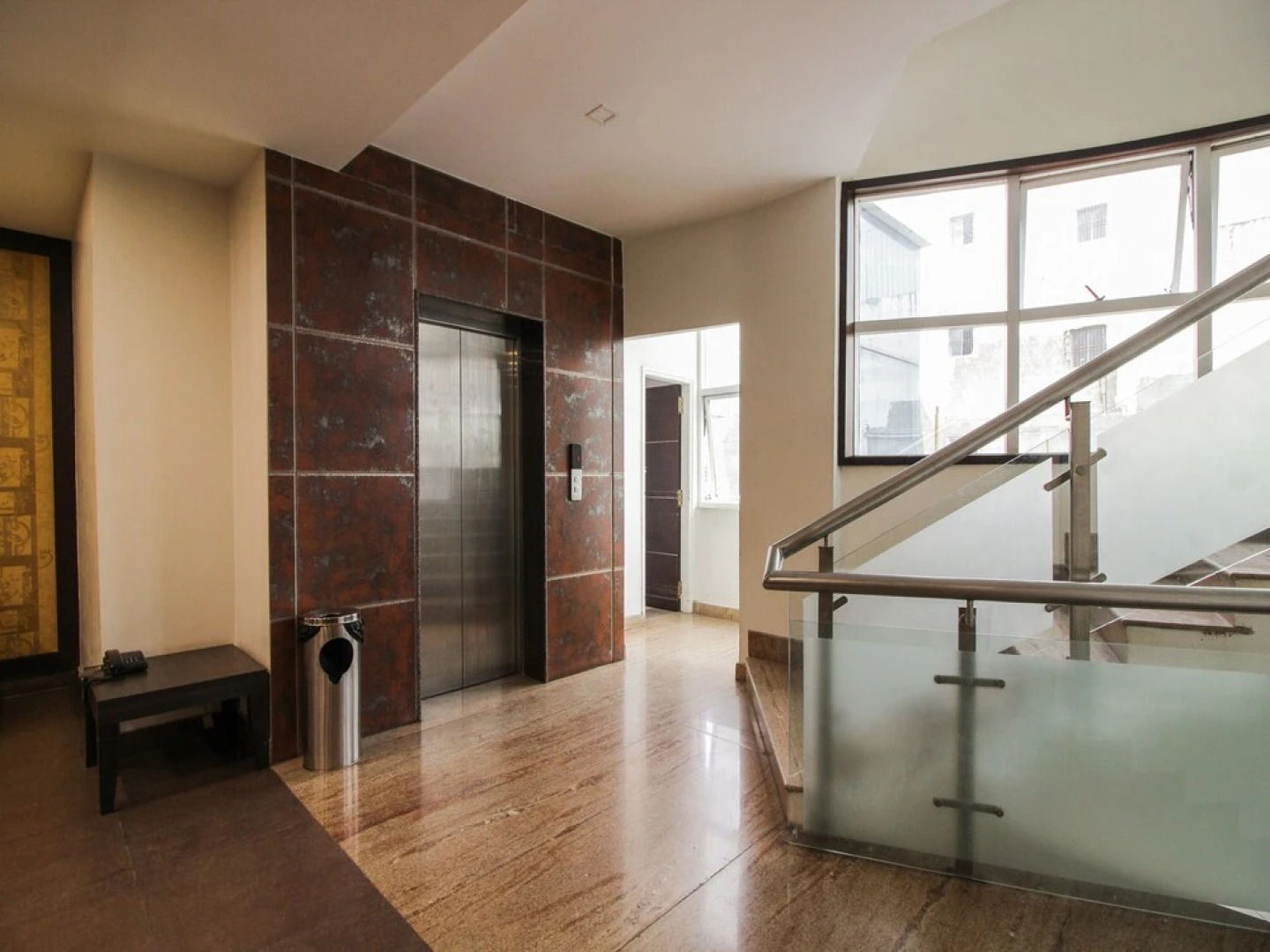 Capital O 15964 NI Ambaari Suites
