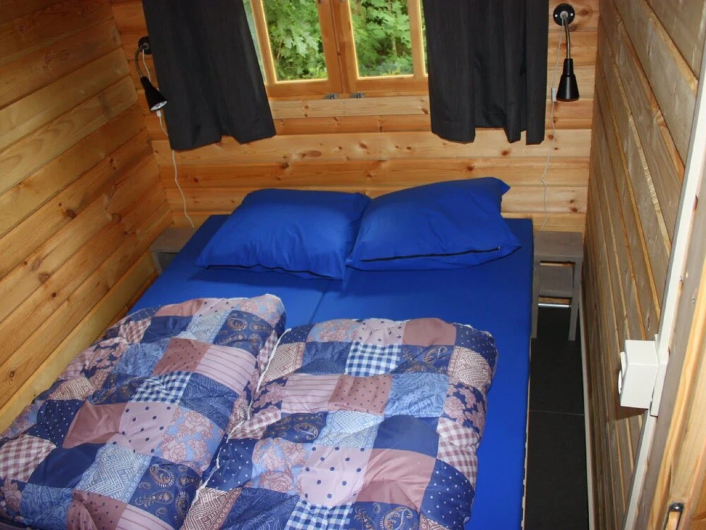 Wooden Cottage With a Veranda Located in a Natural Area