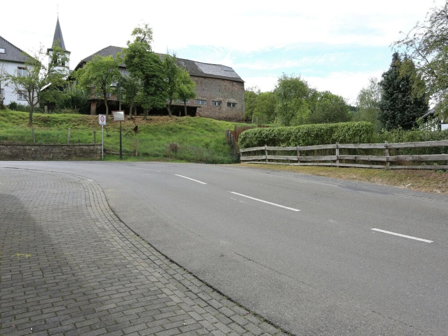 A Lovely Watermill Surrounded by Delightful Greenery