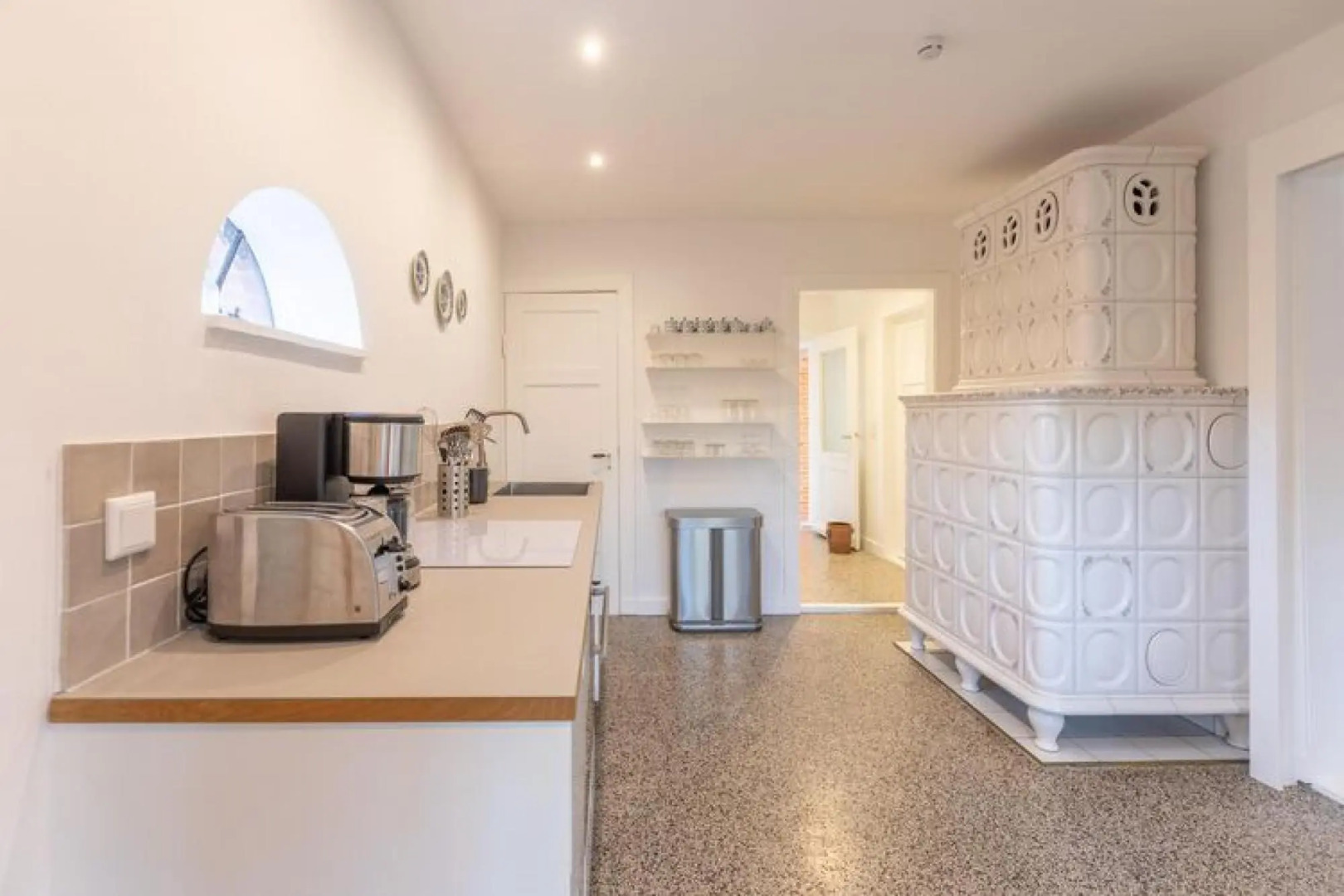 thatched cottage with tiled stove