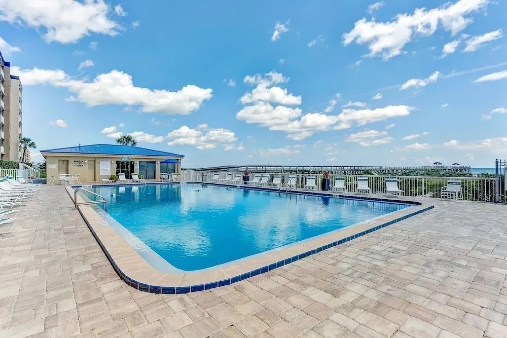 North End Corner Unit with View of the Ocean and Miles of Sandy Beach by RedAwning