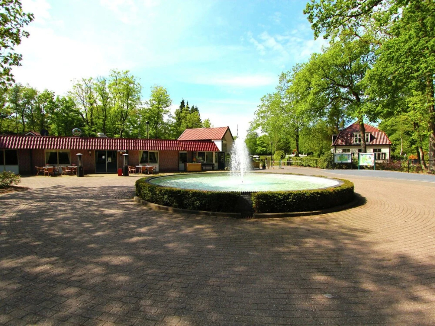 Characteristic house with a garden, surrounded by forest