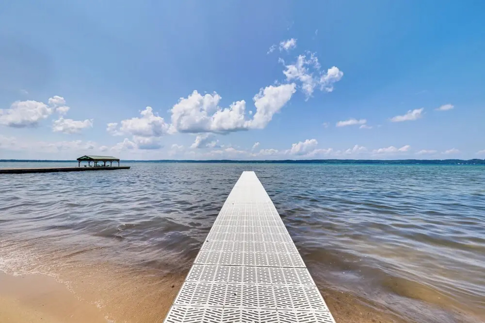 Torch Lake Getaway w/ Private Beach + Boat Dock!