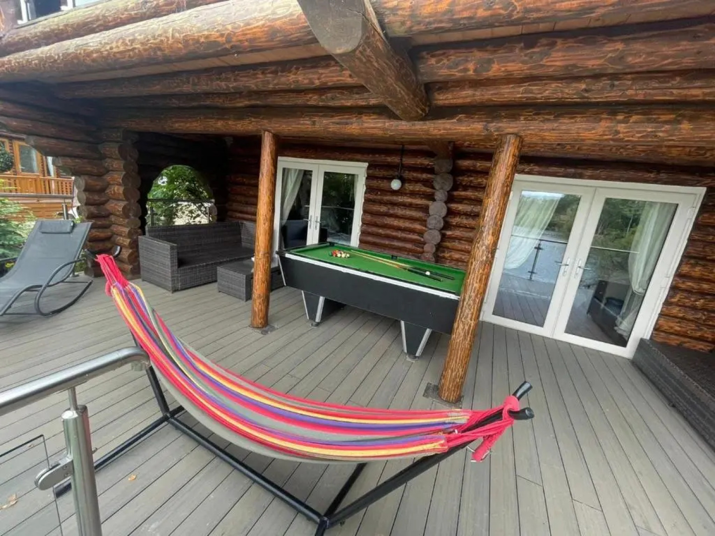 Woodpecker Log Cabin with hot tub, pizza oven bbq entertainment area, lakeside with private fishing peg situated at Tattershall Lakes