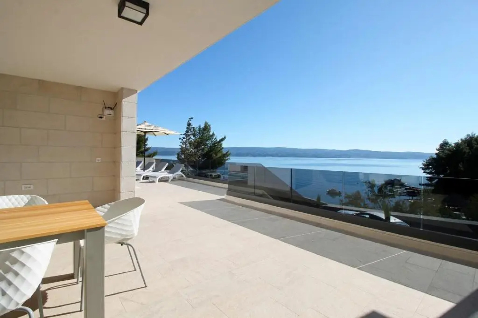 Luxury, seafront Villa Petra with heated pool only 50m from beach