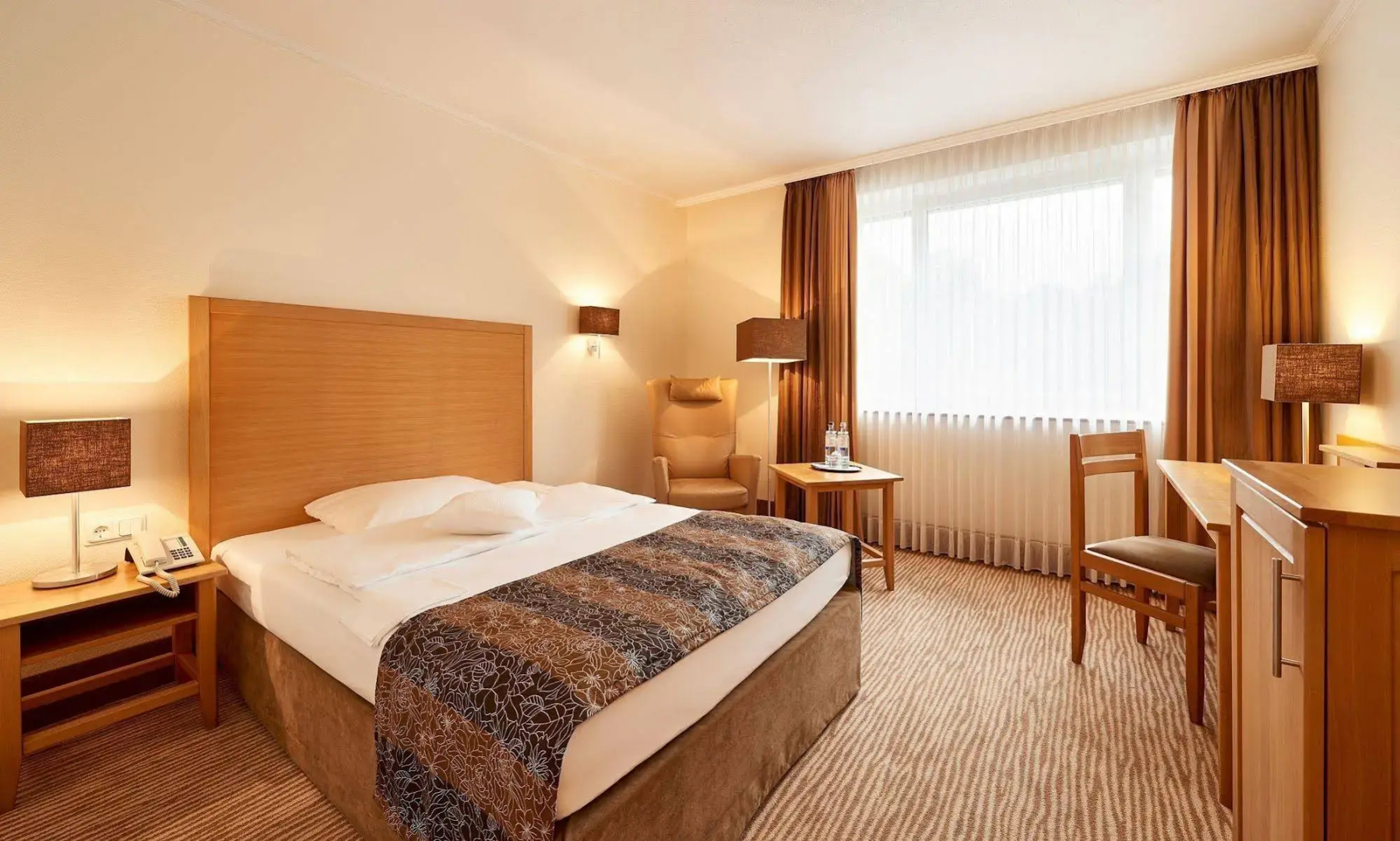 Отель Munte-Wellnesshotel am Stadtwald