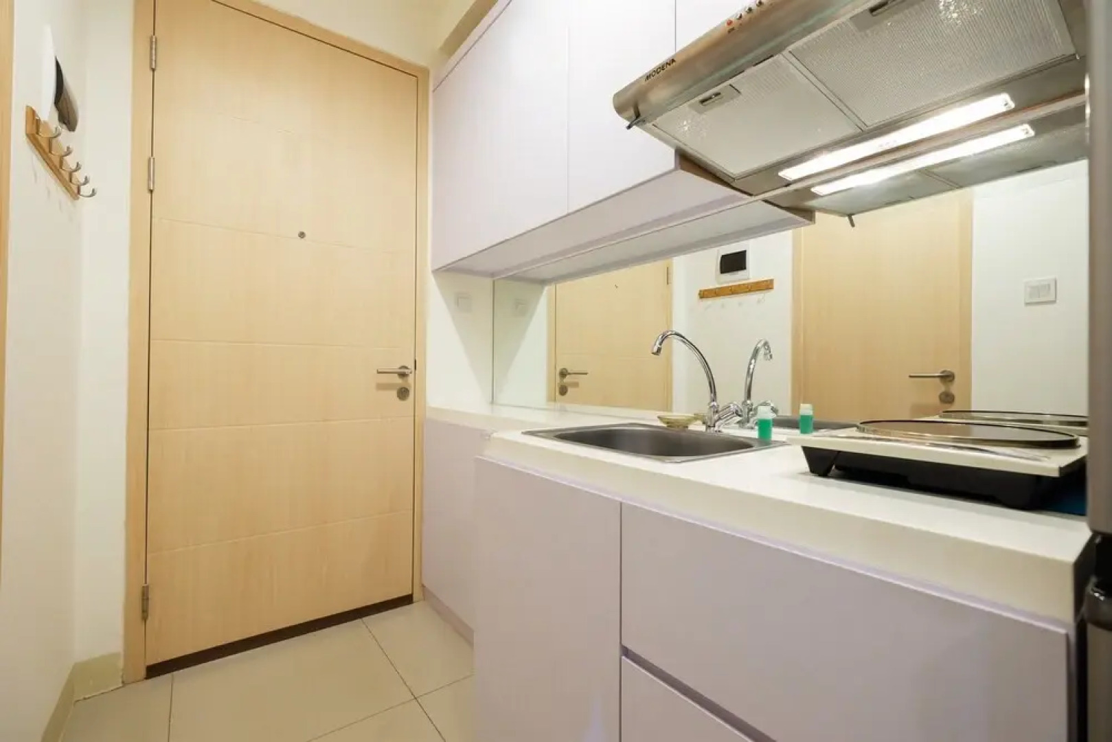 Homey Studio Room Tree Park Apartment near BSD City By Travelio