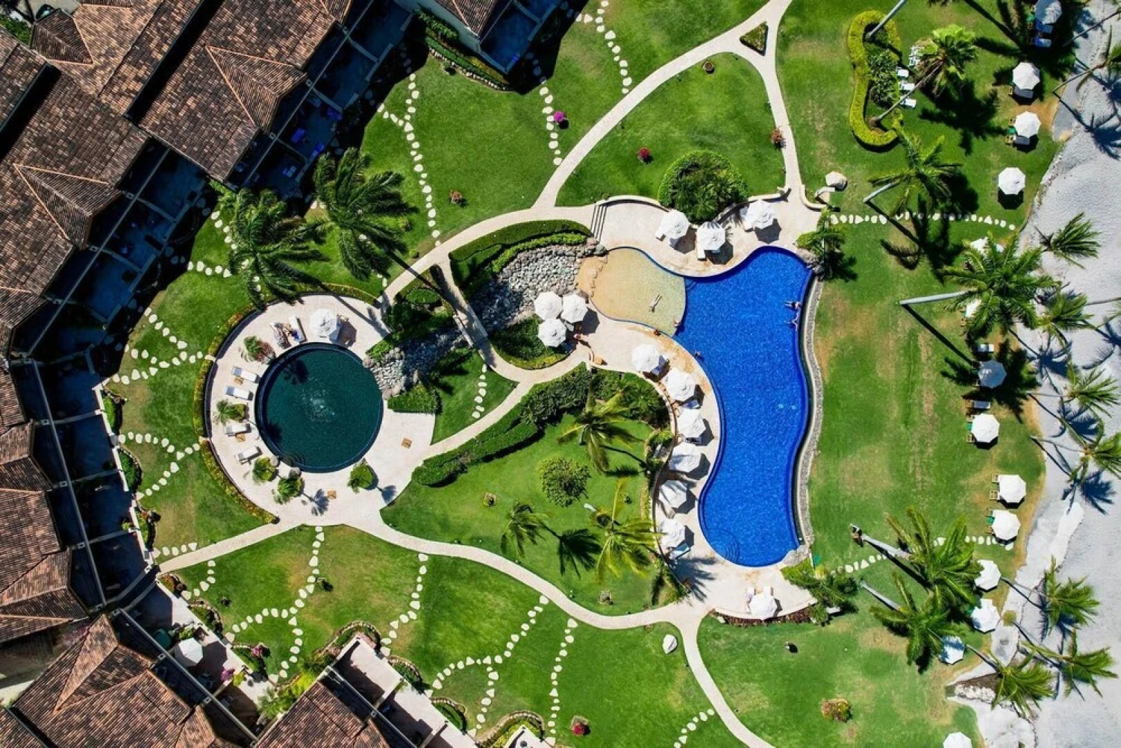 Luxury Beachfront Condo w/ High-End Wood Furnishings and Ocean Views in Exclusive Community