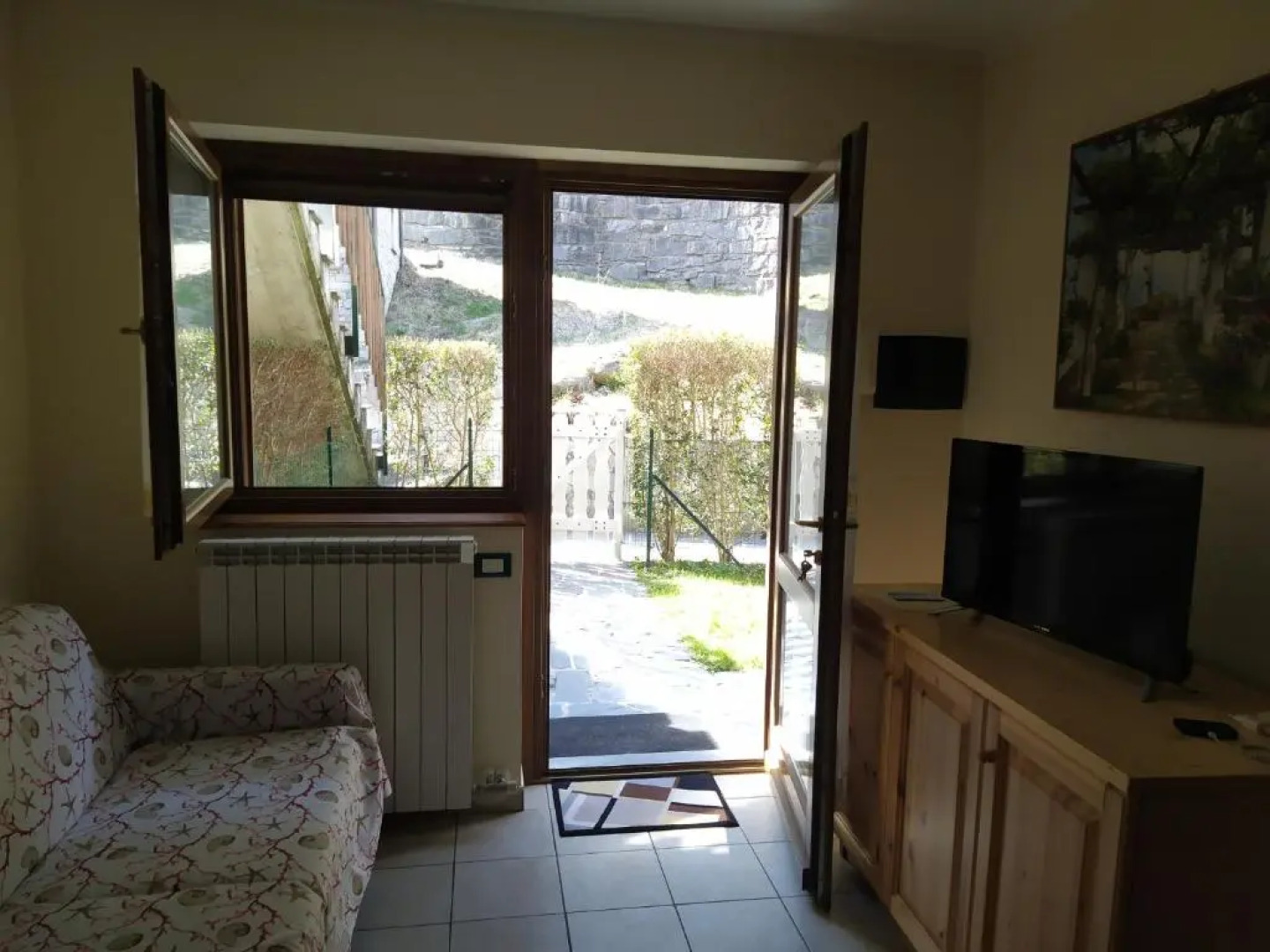 bilocale con giardino e box